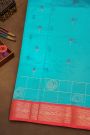 Kuppadam Sico Sky Blue Saree With Florals And Buttis In Checks Body