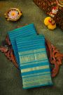 Kancheepuram Silk Peacock Blue Saree With Florals And Peacocks Border