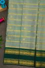 Kancheepuram Silk Sea Green Saree With Zari Lines And Peacock Buttis Body