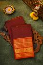 Kancheepuram Silk Maroon Saree With Zari Checks Florals And Peacock Buttis Body