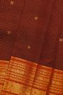 Kancheepuram Silk Maroon Saree With Zari Checks Florals And Peacock Buttis Body