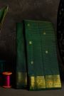 Kancheepuram Silk Bottle Green Saree With Zari Lines Checks Florals And Peacock Buttis Body