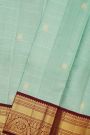 Kancheepuram Silk Sea Green Saree With Peacock Buttis In Zari Checks Body