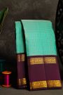 Kancheepuram Silk Sky Blue Saree With Zari Checks And Floral Buttis Body And Gap Border