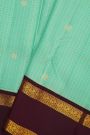 Kancheepuram Silk Sky Blue Saree With Zari Checks And Floral Buttis Body And Gap Border