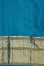Kancheepuram Silk Coral Saree With Florals And Peacock Buttis Body
