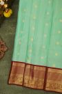 Kancheepuram Silk Sea Green Saree With Zari Lines And Peacocks Border