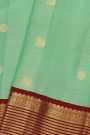 Kancheepuram Silk Sea Green Saree With Zari Lines And Peacocks Border