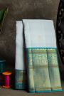 Kancheepuram Silk Sky Blue Saree With Florals And Peacock Buttis Body
