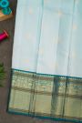 Kancheepuram Silk Sky Blue Saree With Florals And Peacock Buttis Body