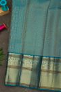 Kancheepuram Silk Sky Blue Saree With Florals And Peacock Buttis Body