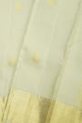 Kancheepuram Silk Off White Saree With Zari Buttis And Peacocks Border