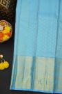 Kancheepuram Silk Sky Blue Saree With Zari Checks Florals And Peacocks Border