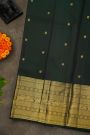 Kancheepuram Silk Dark Green Saree With Florals And Peacock Buttis Body