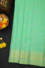 Kancheepuram Silk Sea Green Saree With Florals And Peacock Buttis Body