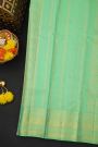 Kancheepuram Silk Sea Green Saree With Florals And Peacock Buttis Body