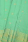 Kancheepuram Silk Sea Green Saree With Florals And Peacock Buttis Body