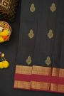Kancheepuram Silk Black Saree With Floral Buttis Body And Gap Border