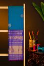 Kancheepuram Silk Blue Saree With Florals And Peacocks In Zari Body And Long Border