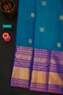 Kancheepuram Silk Blue Saree With Florals And Peacocks In Zari Body And Long Border