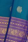 Kancheepuram Silk Blue Saree With Florals And Peacocks In Zari Body And Long Border