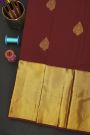 Kancheepuram Silk Maroon Saree With Florals And Leaves In Zari Body Long Kaddi Border