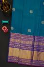 Kancheepuram Silk Blue Saree With Florals And Peacock Buttis In Zari Body