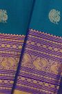 Kancheepuram Silk Blue Saree With Florals And Peacock Buttis In Zari Body