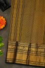 Kancheepuram Silk Black Saree With Florals And Peacock Buttis Body