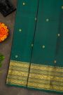 Kancheepuram Silk Bottle Green Saree With Floral Peacock And Elephant Zari Border