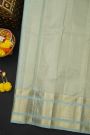 Kancheepuram Silk Ice Blue Saree With Checks And Floral Buttis Body