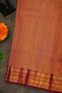 Kancheepuram Silk Magenta Saree With Zari Checks Floral And Peacock Buttis Body