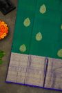 Kancheepuram Silk Peacock Green Saree With Florals And Leaves Border