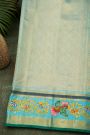 Gadwal Silk Orange Saree With Tanjore Hand-Painted Veena Peacock & Floral Zari Border