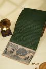 Fancy Kora Bottle Green Saree With Florals And Women Motifs Border