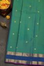 Kancheepuram Silk Sea Green Saree With Floral Buttis Body Gap Border