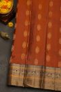Kancheepuram Silk Rust Black Saree With Florals And Peacocks Border