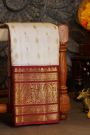 Kancheepuram Silk Off White Saree With Florals And Buttis Maroon Border