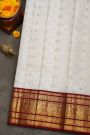Kancheepuram Silk Off White Saree With Florals And Buttis Maroon Border