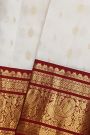 Kancheepuram Silk Off White Saree With Florals And Buttis Maroon Border