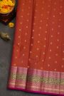 Kancheepuram Silk Rust Orange Saree With Florals And Leaves Jaal With Peacocks Border