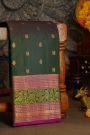 Kancheepuram Silk Bottle Green Saree With Florals And Leaves With Peacocks In Zari Border