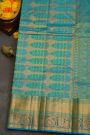 Kancheepuram Silk Green Saree With Florals And Peacocks In Cross Lines Border