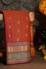 Kancheepuram Silk Rust Saree With Florals And Leaves With Cross Lines Border