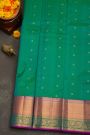Kancheepuram Silk Peacock Green Saree With Florals And leaves In Cross Lines Border