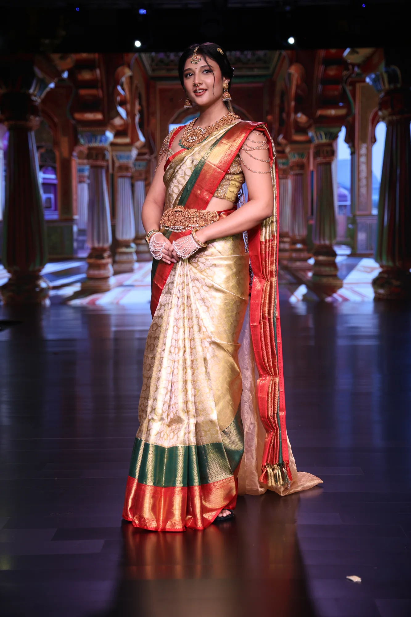 The bride in the all-over zari saree, with the four highlighted details marked