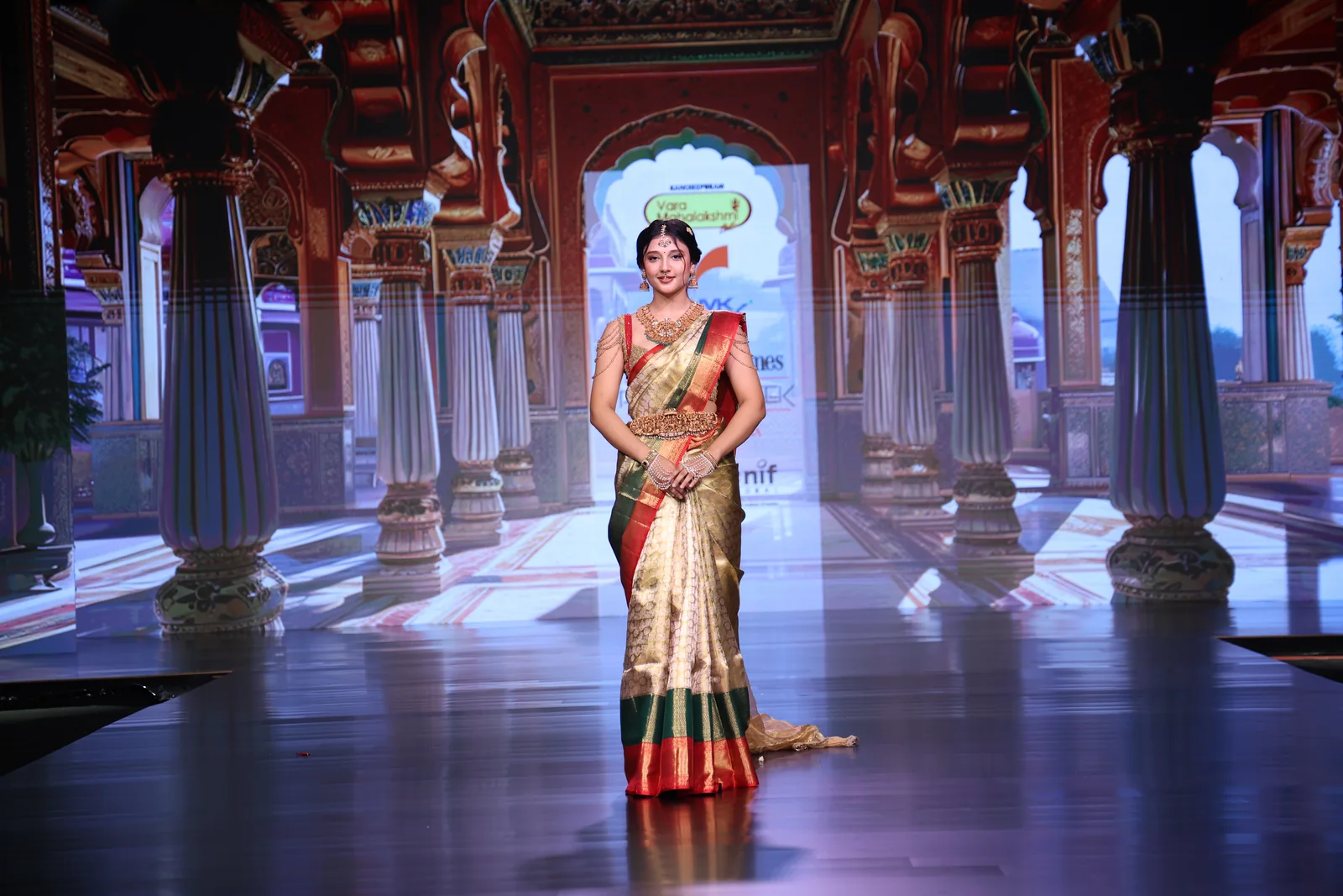 A bride wearing the all-over zari Kanchipuram saree with its red and green double border