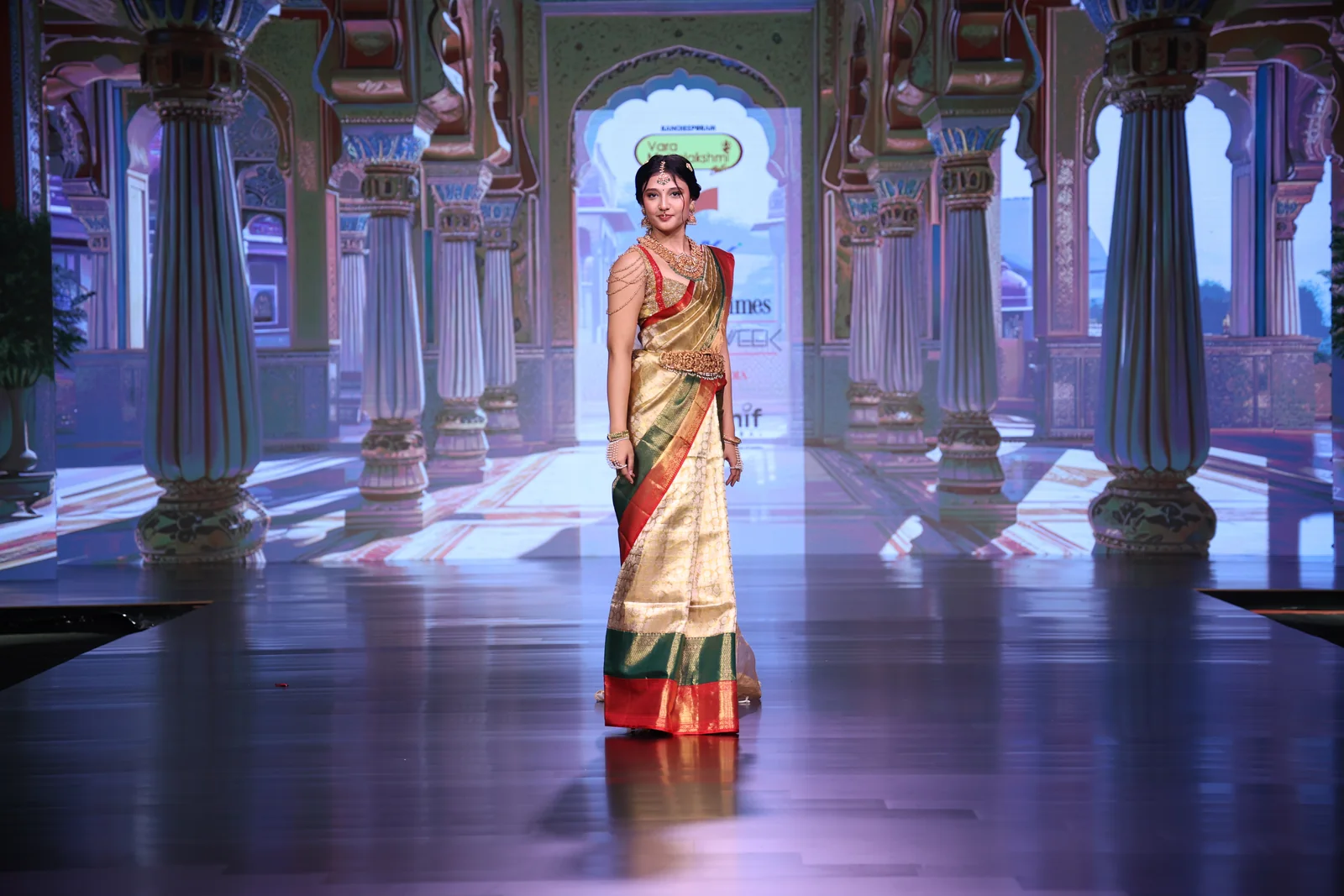Kanchipuram saree presented against an ornate architectural backdrop